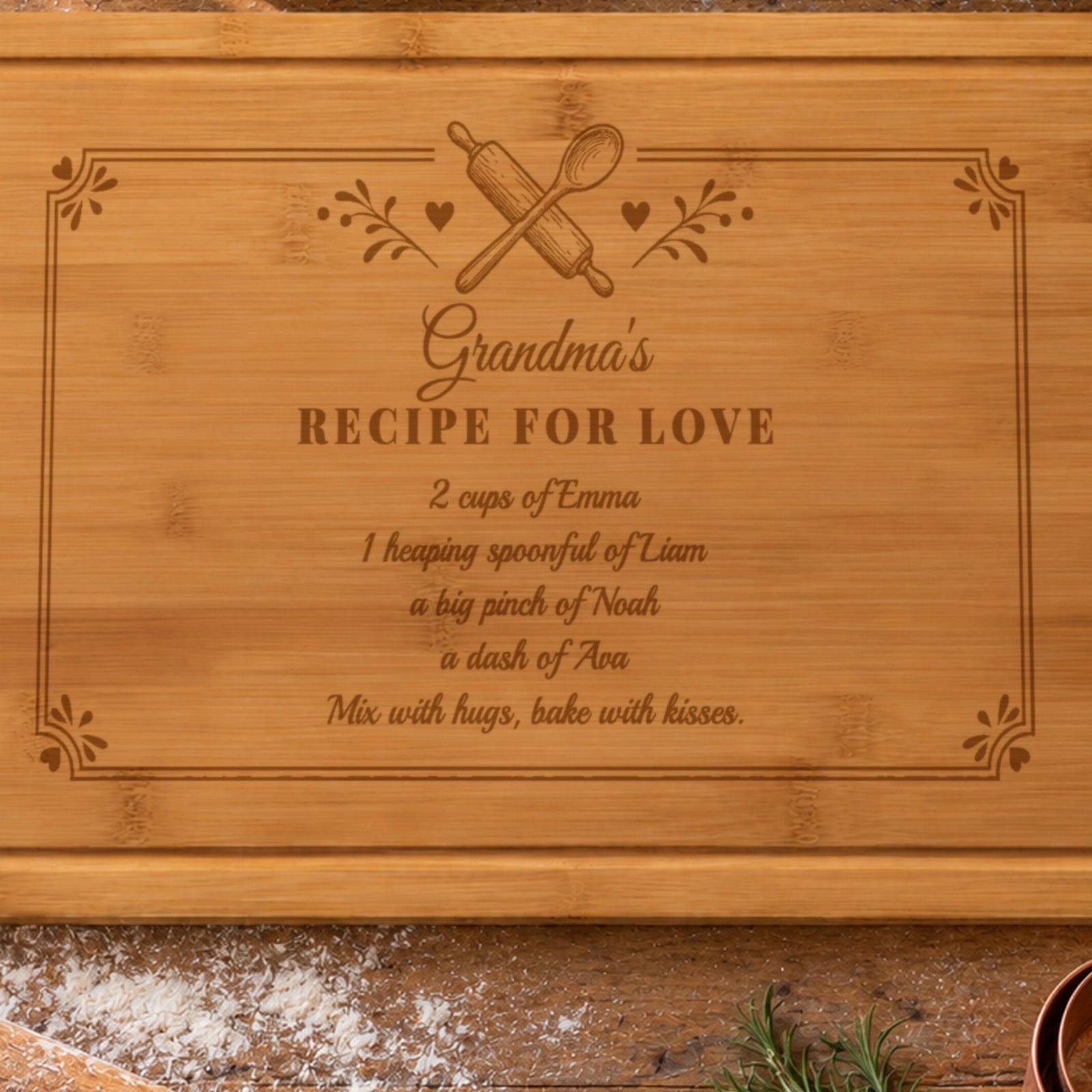 Close-up of the laser engraving on the grandma recipe board: Grandma's Recipe for Love, 2 cups of Emma, 1 heaping spoonful of Liam