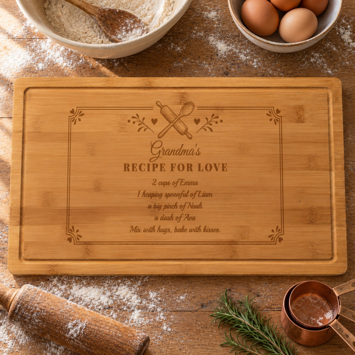 Grandma recipe cutting board engraved Grandma's Recipe for Love with 2 cups of Emma, a big pinch of Noah and more grandkids, on a flour-dusted baking table