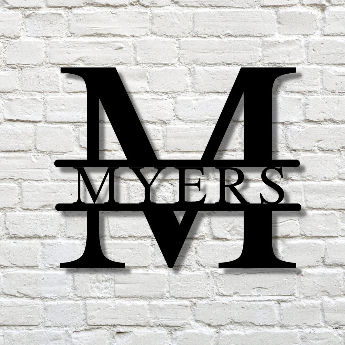 Custom split-letter metal sign with personalized family name and initial