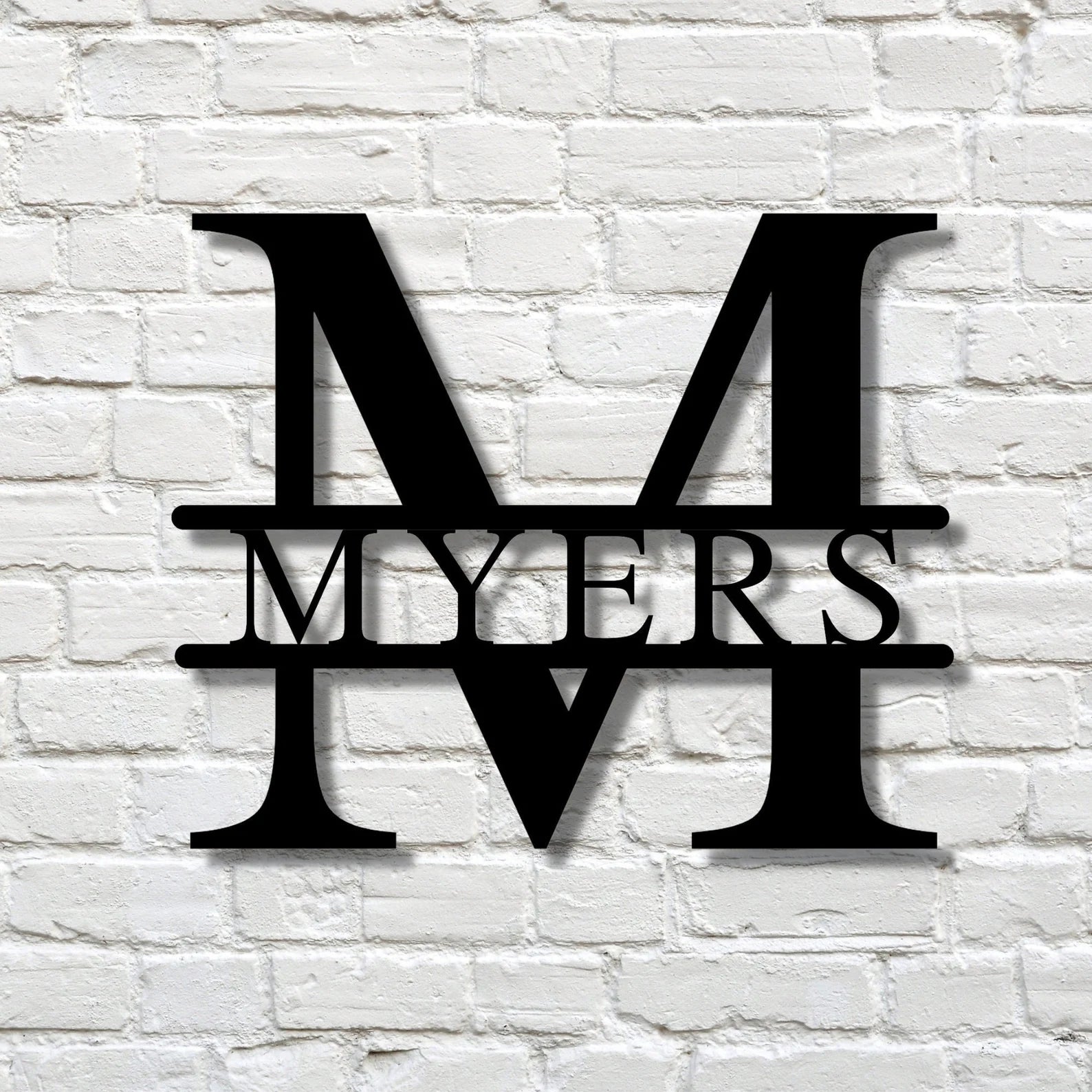 Custom split-letter metal sign with personalized family name and initial