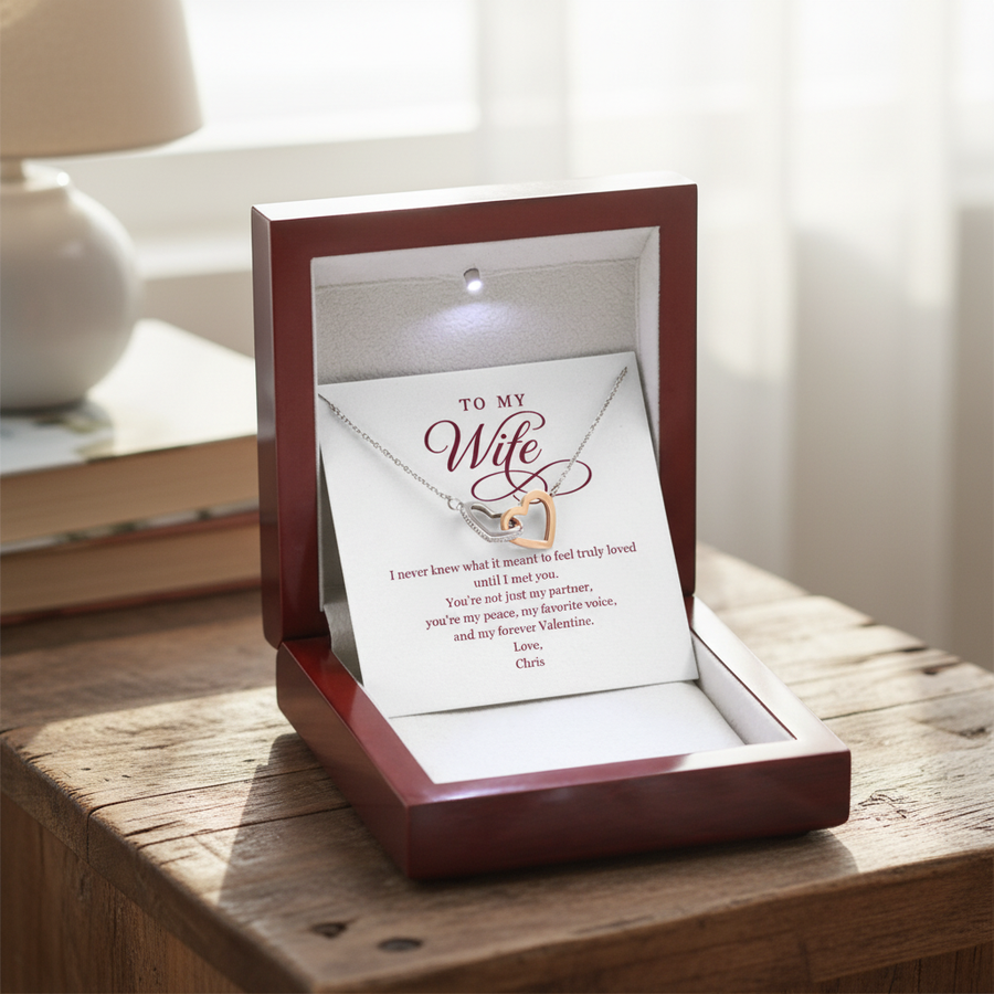Two-heart necklace with CZ crystals displayed in open mahogany box with sample personalized message card signed "Chris