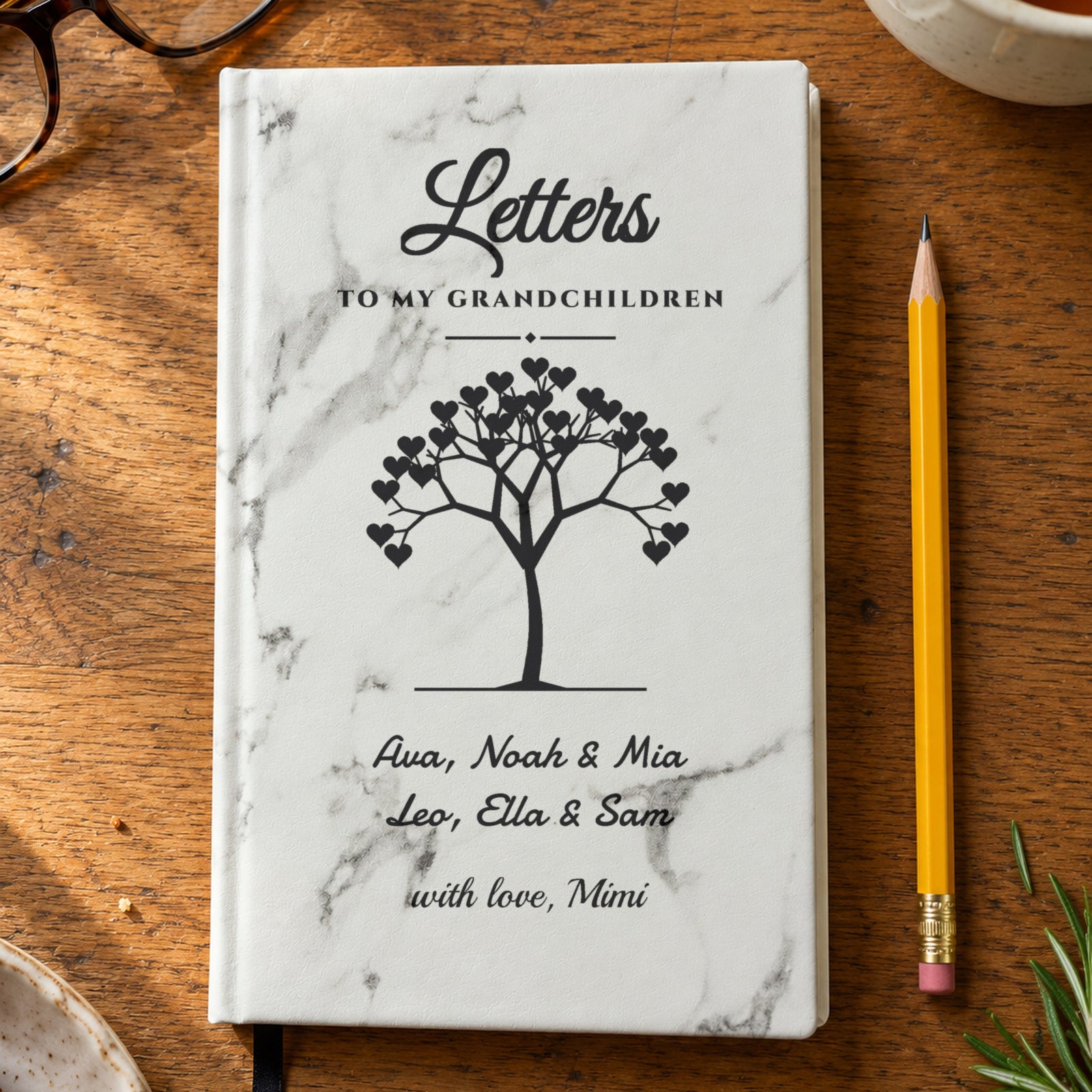 Letters to My Grandchildren journal with a white marble cover engraved with a heart tree, Ava, Noah & Mia, Leo, Ella & Sam and with love, Mimi, one of the best gifts for grandma