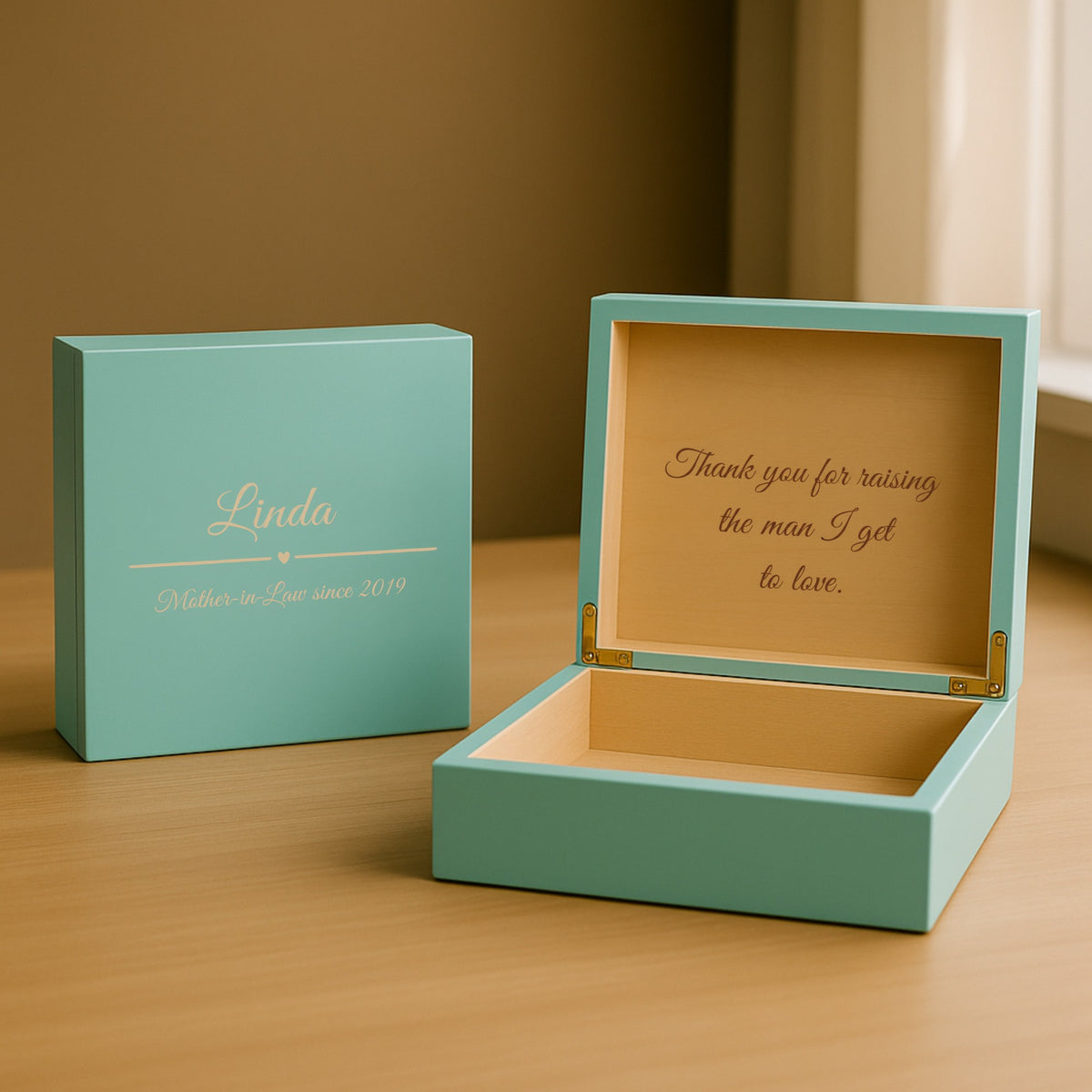 Teal personalized keepsake jewelry box engraved with a mother-in-law's name on the lid, shown open with a script thank-you message inside the cedar lid