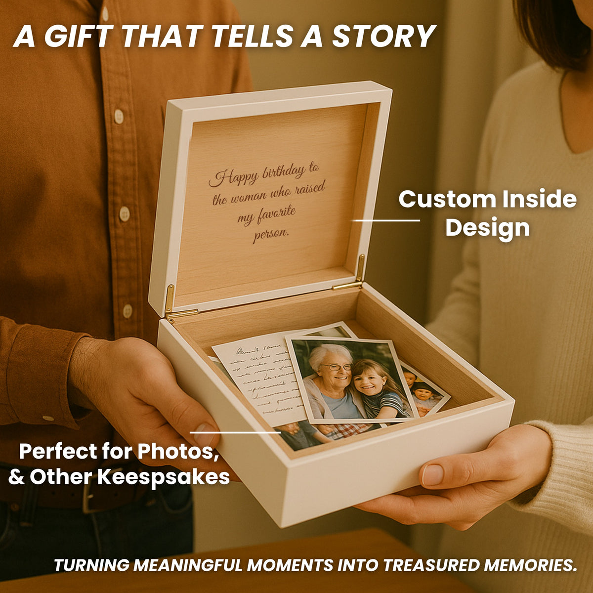Hands holding an open white engraved jewelry box with a birthday message for a mother-in-law inside the lid and family photos tucked in the cedar-lined interior