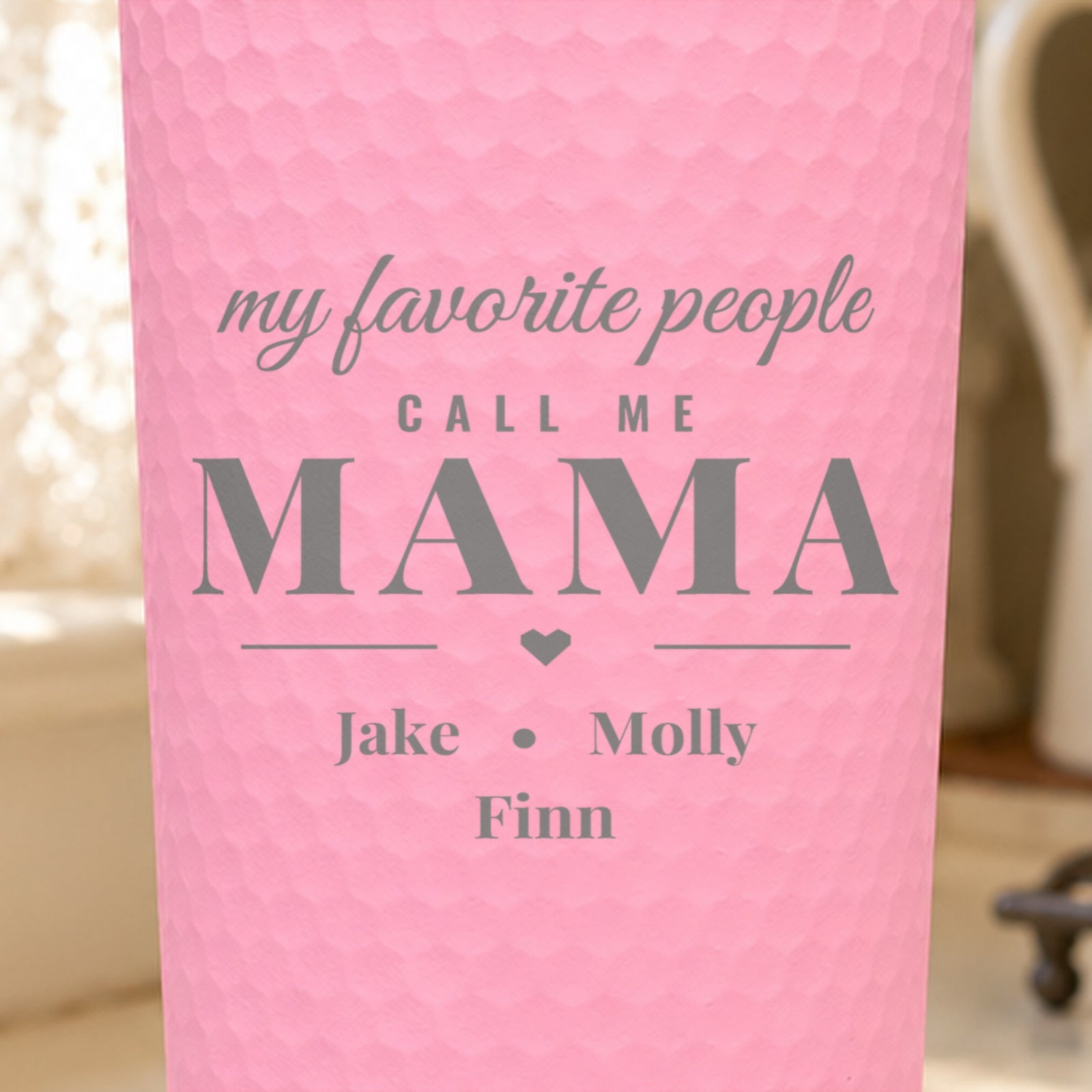 Close-up of the laser engraving on a pink dimpled tumbler: my favorite people call me MAMA with Jake, Molly and Finn below