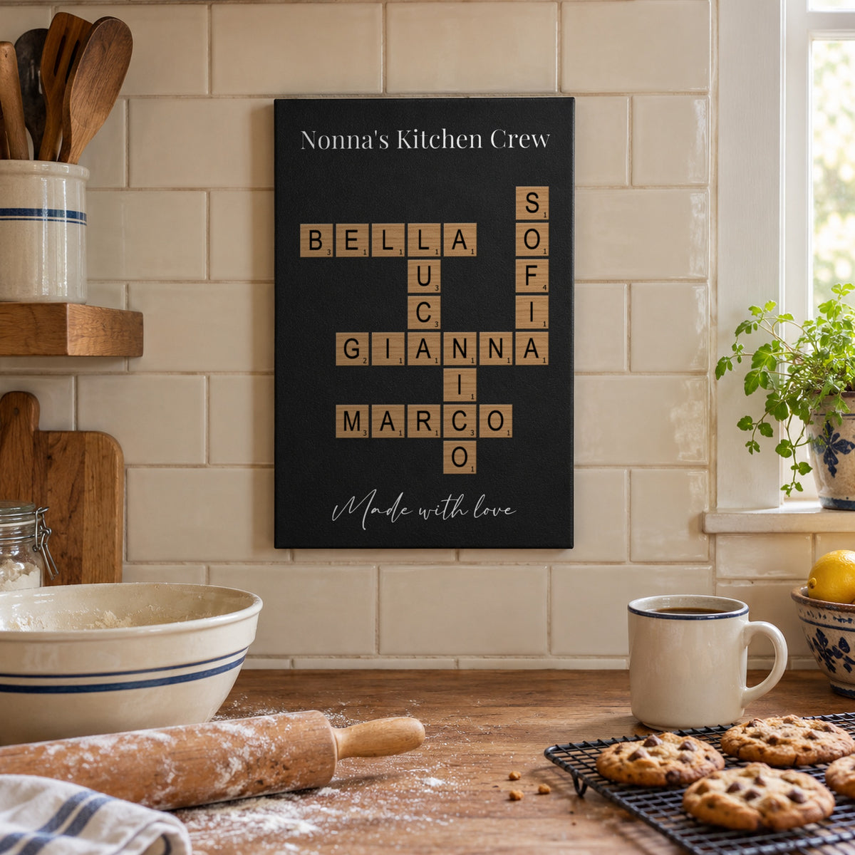 Gift for Nonna: a Nonna's Kitchen Crew crossword sign with the grandkids' names hanging in a sunny kitchen above fresh baked cookies