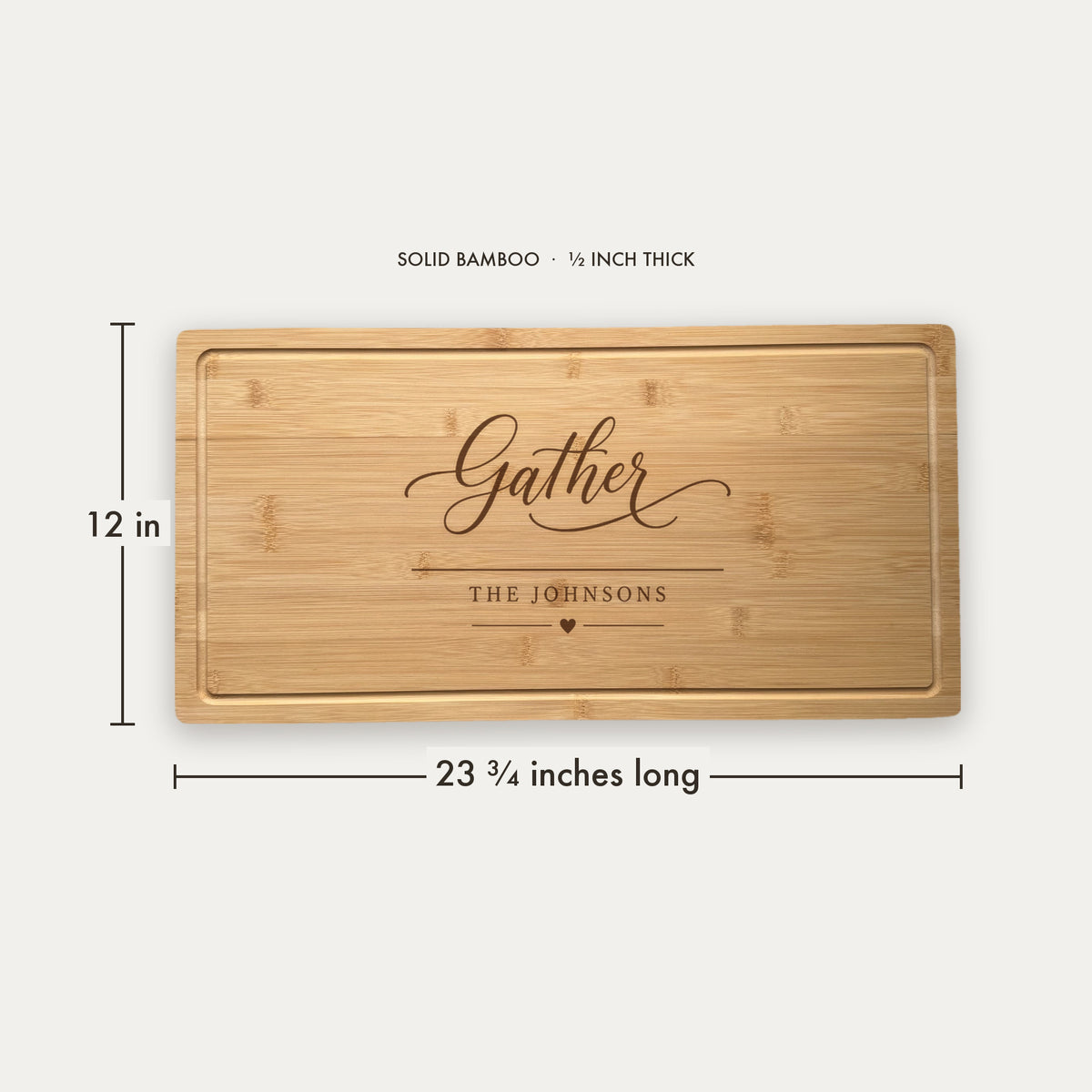 Size guide for the personalized hostess charcuterie board, 23 and three quarter inches long by 12 inches wide in half inch thick solid bamboo.