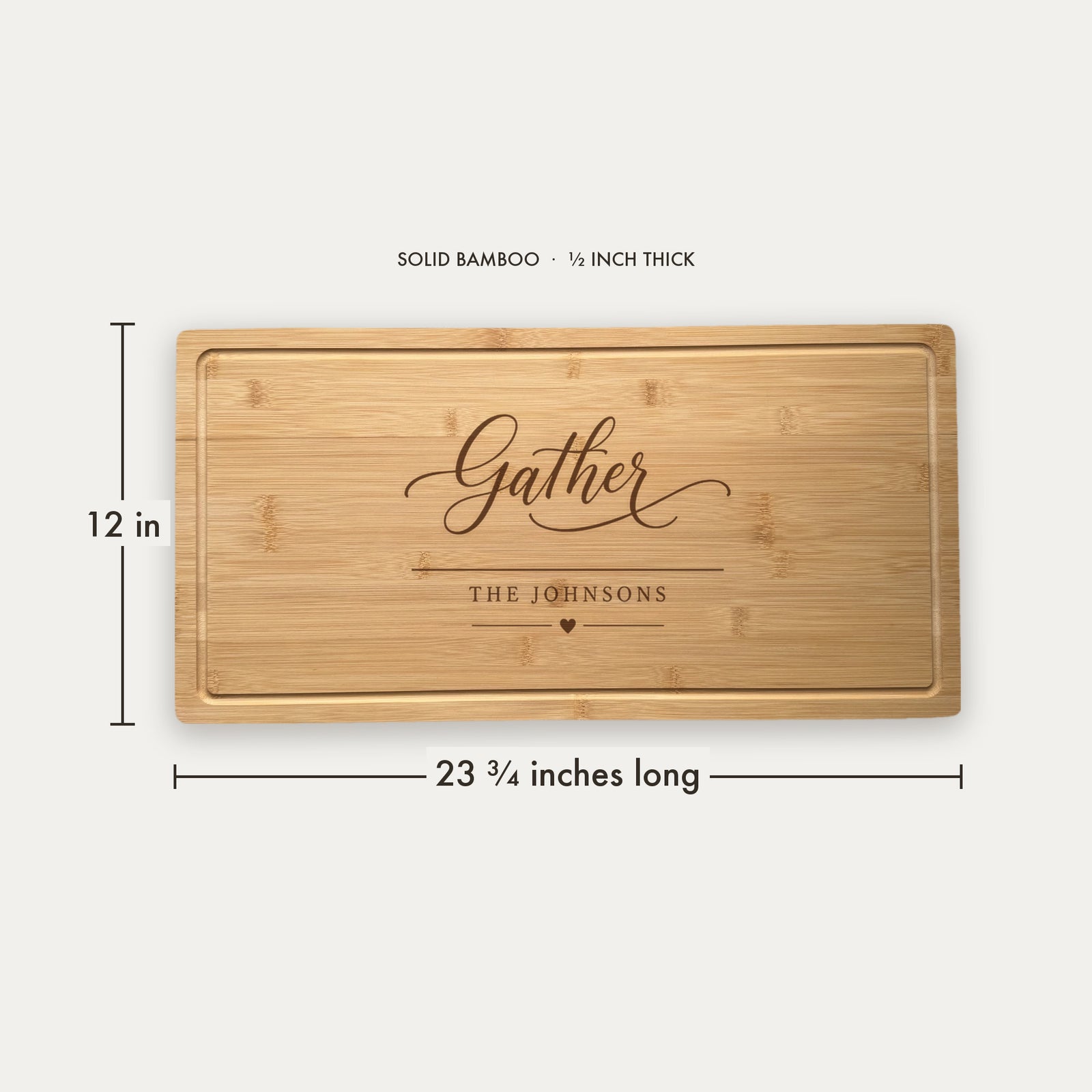 Size guide for the personalized hostess charcuterie board, 23 and three quarter inches long by 12 inches wide in half inch thick solid bamboo.