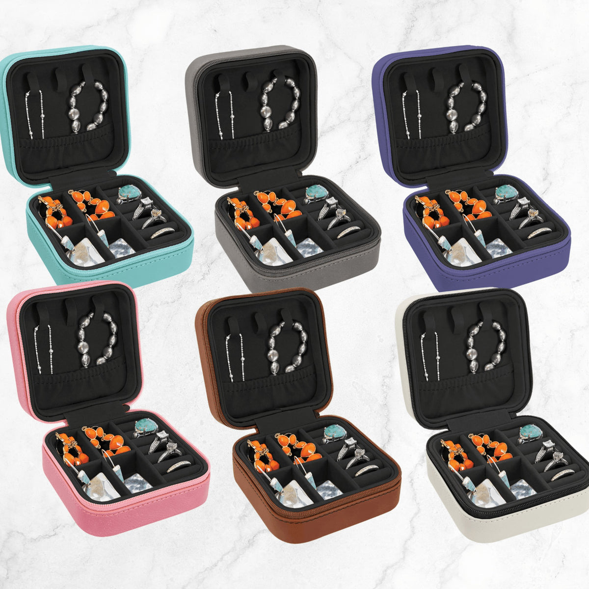 Six open leatherette travel jewelry boxes showing the lined interior with slots for rings, a section for earrings and room for necklaces
