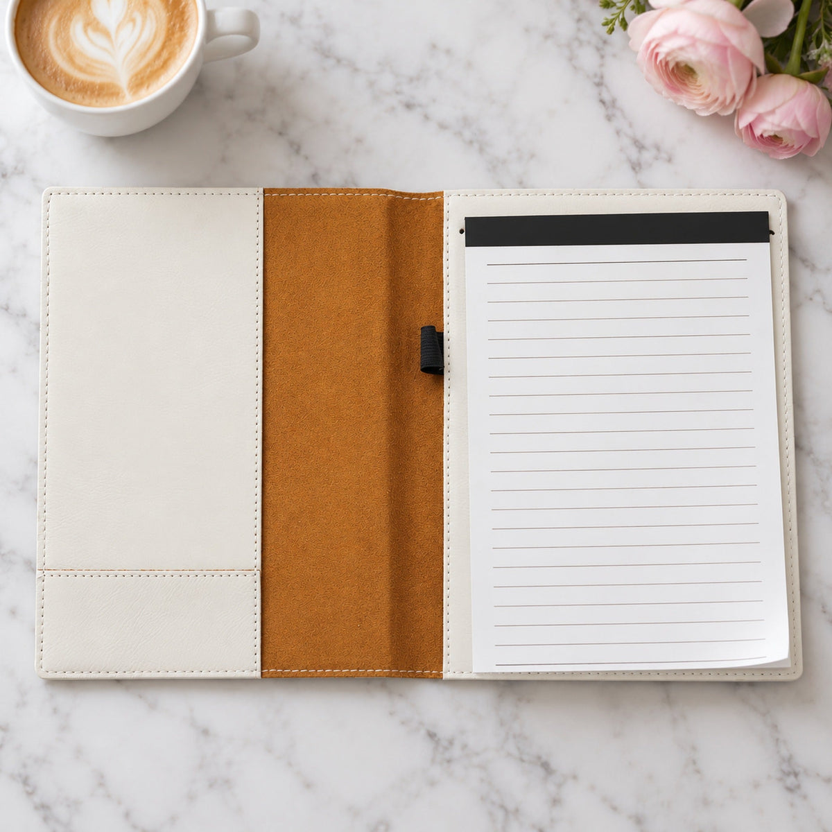 Inside the white padfolio: a lined 50-page notepad on the right, an empty elastic pen loop on tan lining and a full-height pocket on the left