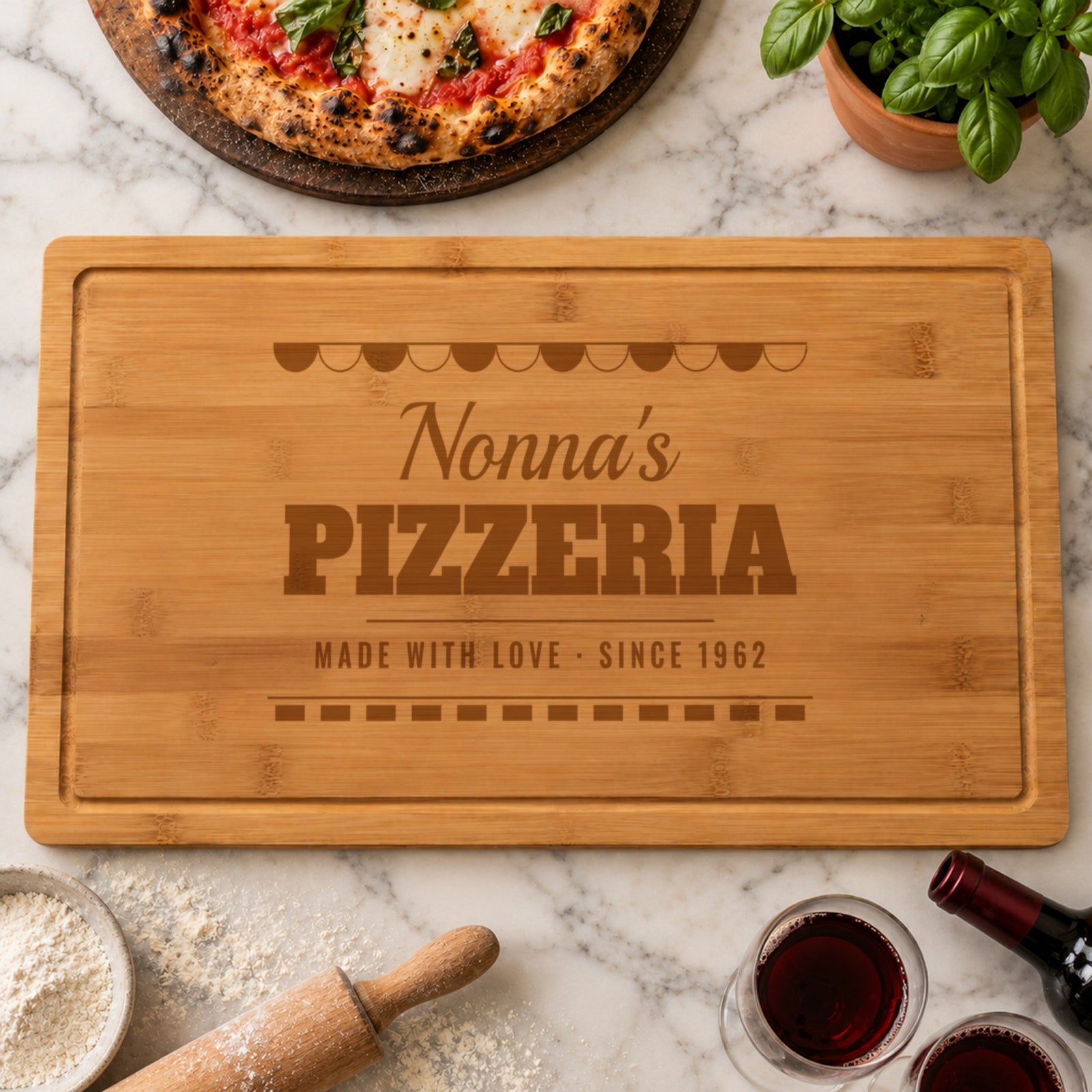 Personalized pizza board for Nonna engraved like an Italian pizzeria sign, Nonna's PIZZERIA MADE WITH LOVE SINCE 1962, on marble with a margherita pizza and red wine