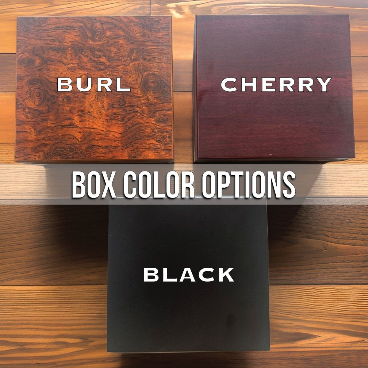 Three finish options for the tooth fairy keepsake box shown as closed lids on a wood table: burl with swirled grain, cherry with a reddish tone and matte black