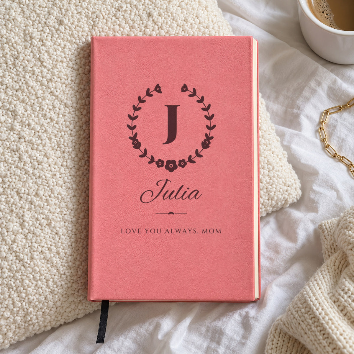 Pink personalized journal engraved with J in a wildflower crest, Julia in script and the message Love You Always, Mom