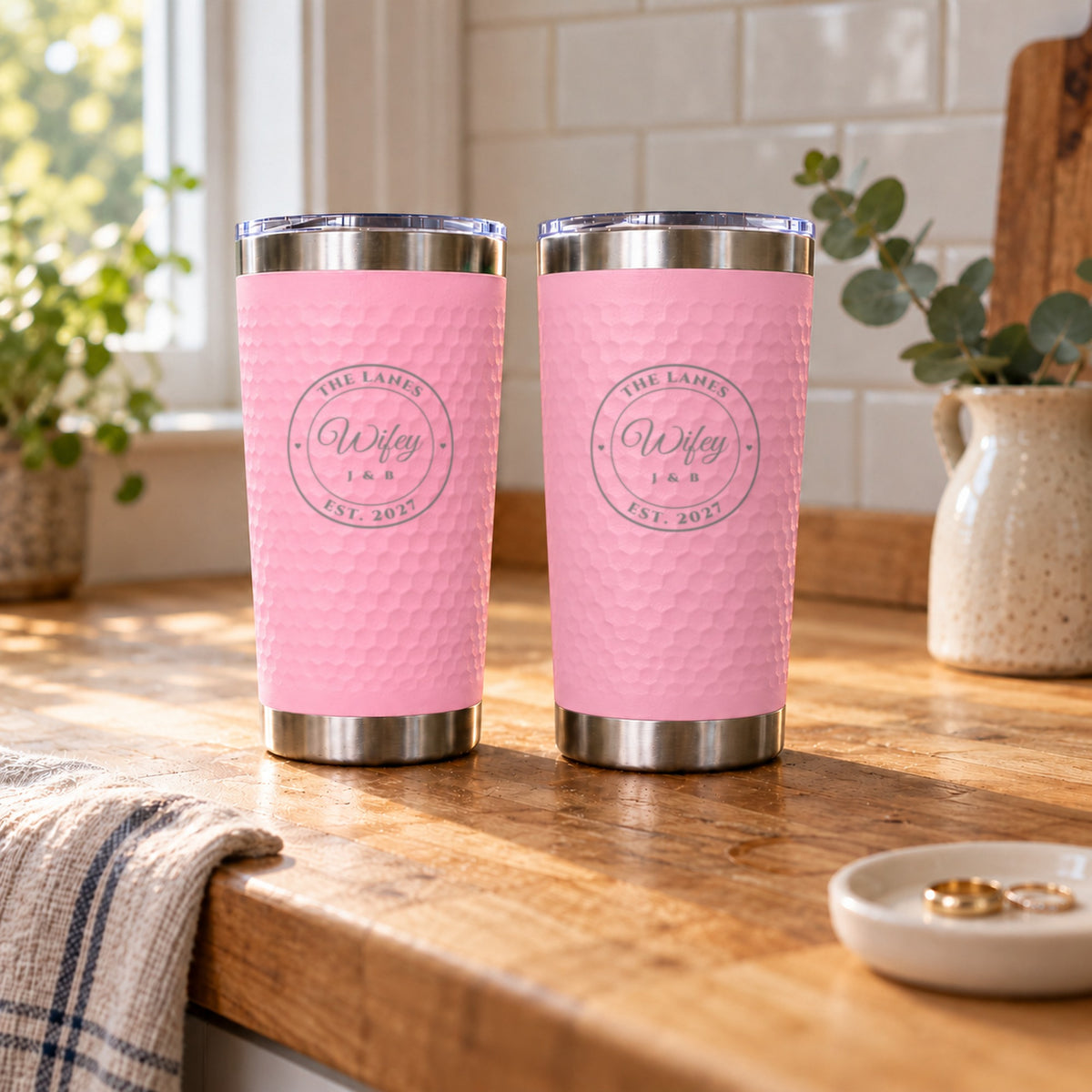 Two soft pink engraved tumblers reading Wifey and Wifey for The Lanes, Est. 2027, the pink and pink color choice of the couples set