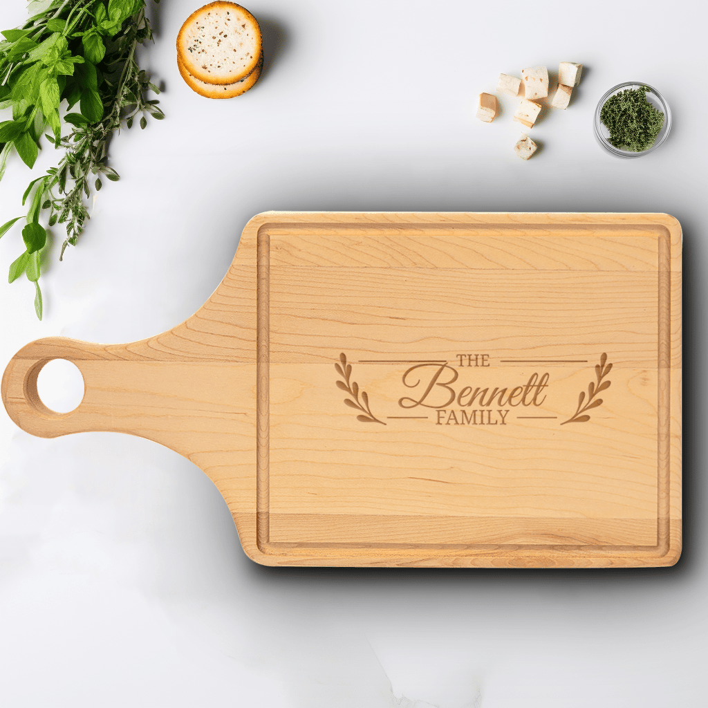 Family Name Maple Paddle Cutting Board With Flourishing Family Design