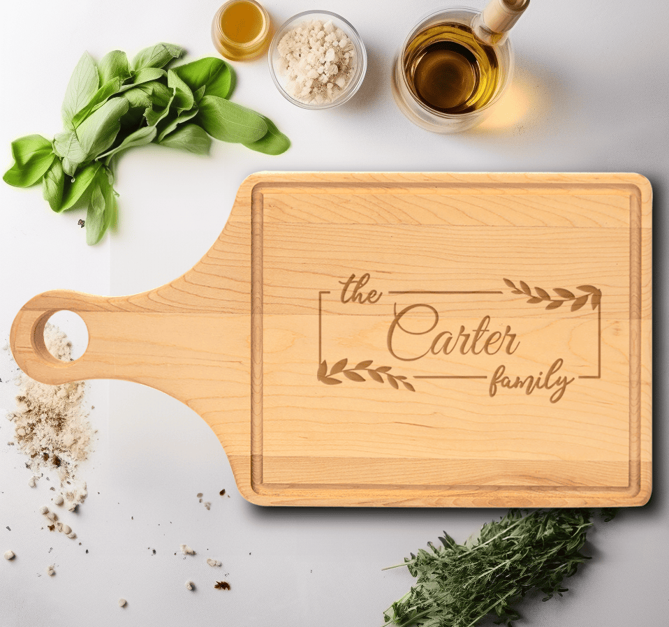 Family Name Maple Paddle Cutting Board With Roots And Rings Design