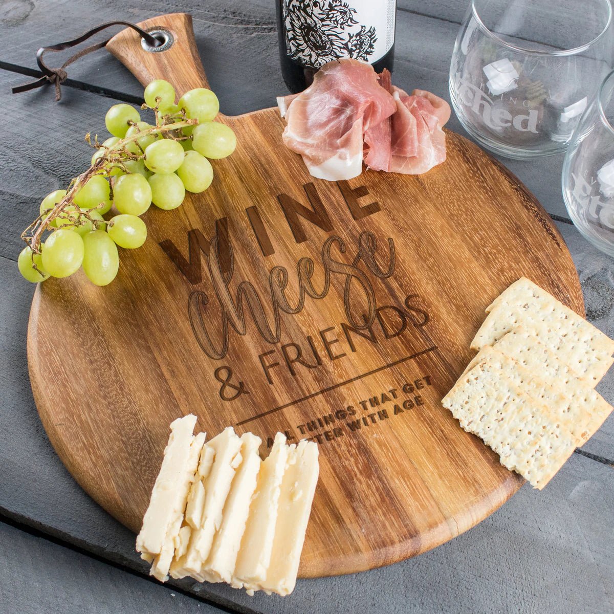https://www.groovygirlgifts.com/cdn/shop/products/cutting-board-round-charcuterie-board-for-friends-design-betterwithage-620370_1200x.jpg?v=1683467842